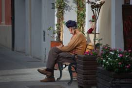 Old man sitting outside